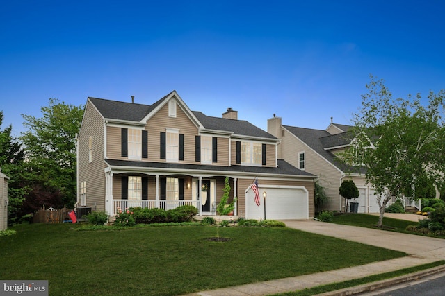 9033 Allington Manor Cir W, Frederick, MD 21703 - view of front of house with covered porch, central AC, driveway, a garage, and a front lawn