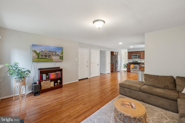 9033 Allington Manor Cir W, Frederick, MD 21703 - living area featuring baseboards, light wood finished floors, and recessed lighting