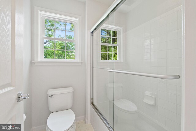 bathroom featuring toilet and baseboards