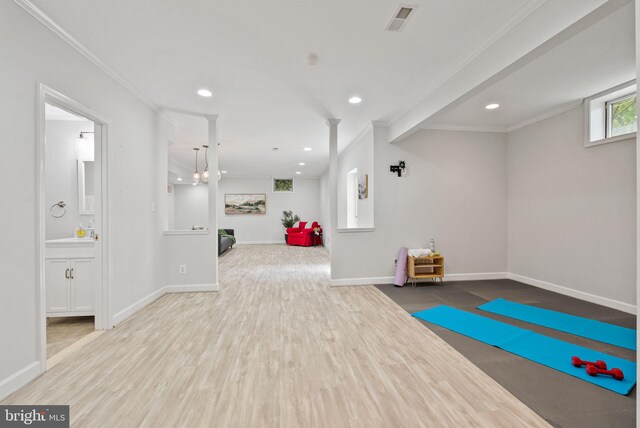 workout room with crown molding, recessed lighting, wood finished floors, and visible vents