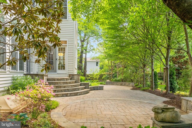 doorway to property with a patio area
