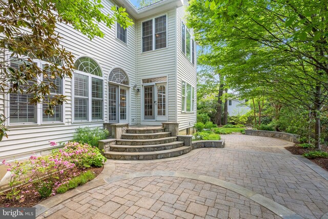 doorway to property featuring a patio