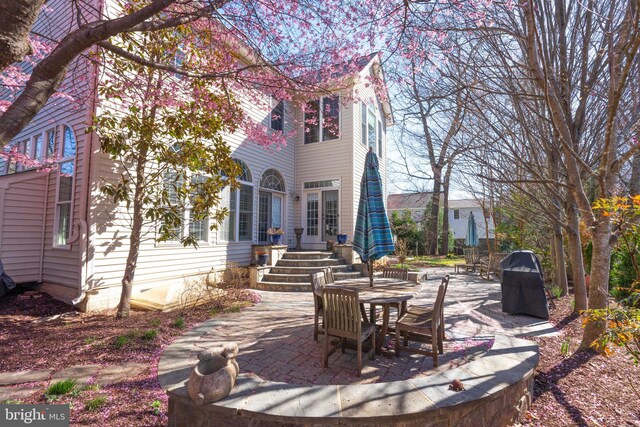 back of house with a patio