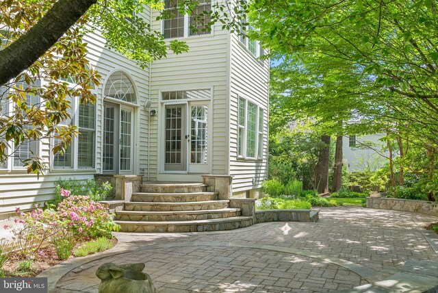 property entrance with a patio