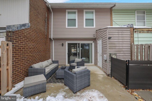 view of patio featuring outdoor lounge area and fence