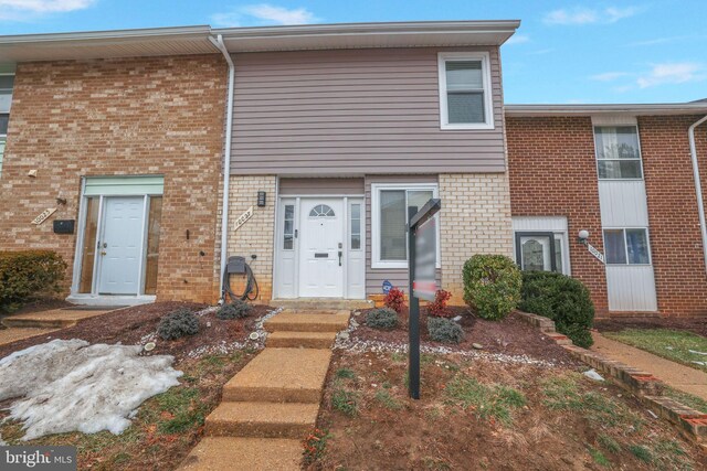 multi unit property featuring brick siding