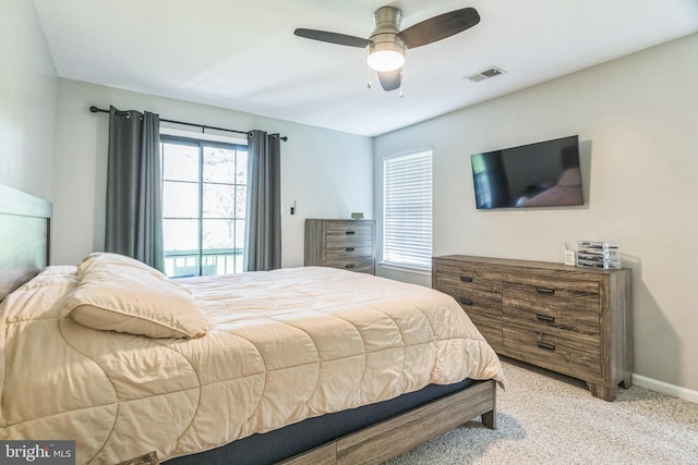bedroom with baseboards, ceiling fan, light carpet, and visible vents