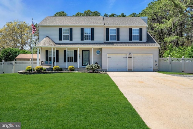 view of front of property featuring a porch, fence, driveway, and a front lawn