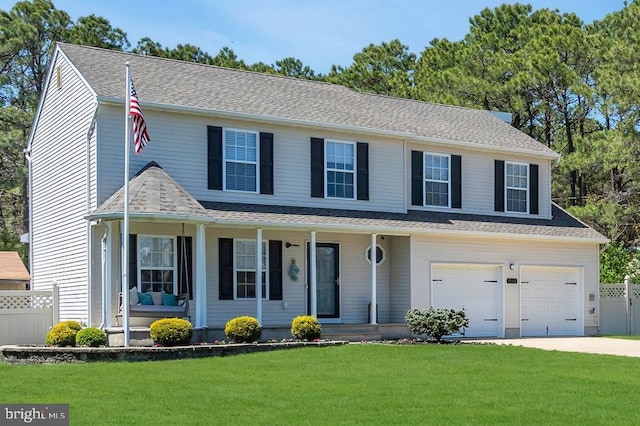 view of front of property with fence, covered porch, a front yard, an attached garage, and driveway