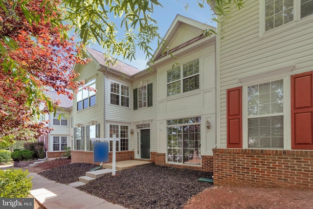 exterior space with brick siding
