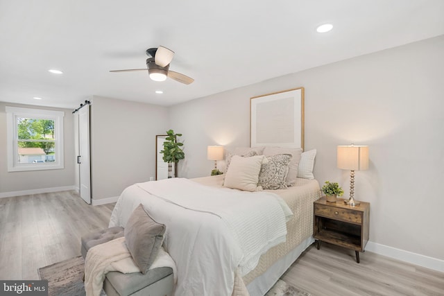bedroom featuring a ceiling fan, baseboards, recessed lighting, and light wood-type flooring