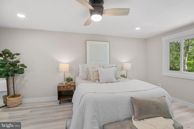 bedroom featuring recessed lighting, baseboards, a ceiling fan, and light wood-type flooring