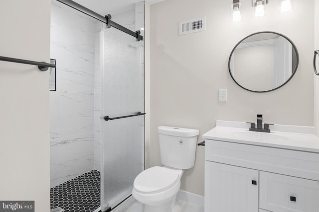 bathroom with vanity, toilet, a marble finish shower, baseboards, and visible vents
