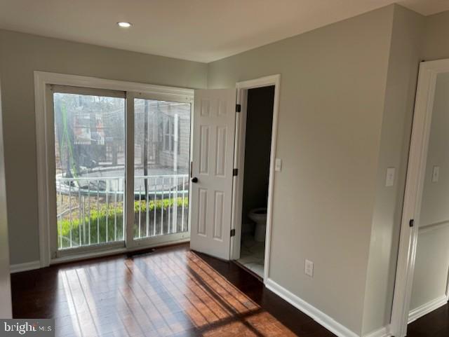 interior space with recessed lighting, baseboards, and wood finished floors