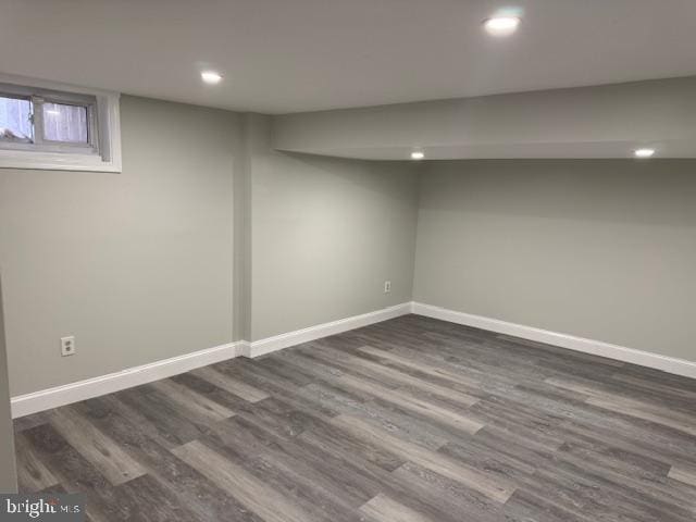 finished basement featuring recessed lighting, baseboards, and dark wood-style floors