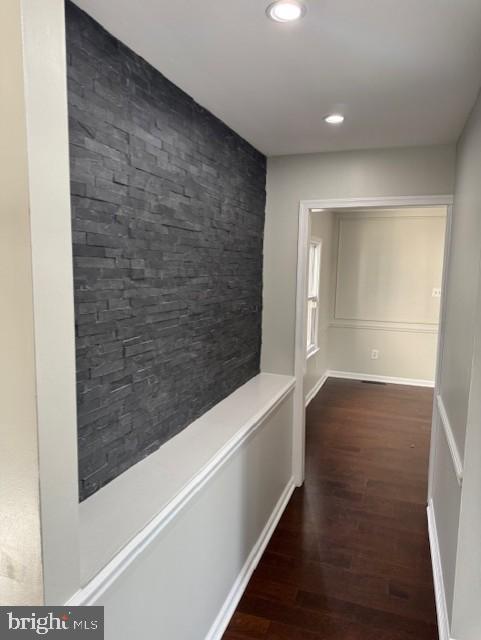 corridor with recessed lighting and dark wood finished floors