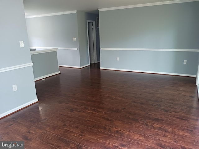 unfurnished room with baseboards, ornamental molding, and hardwood / wood-style floors