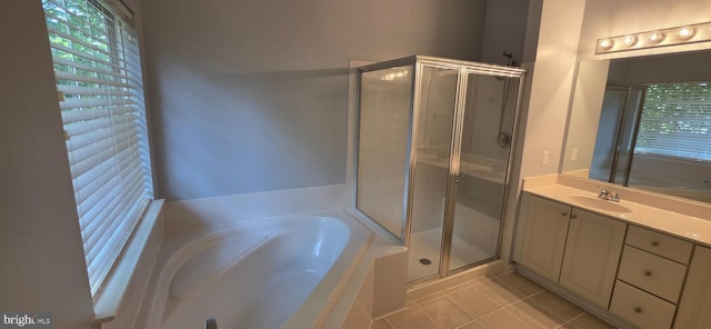 43183 Glenelder Ter, Ashburn, VA 20147 - bathroom with tile patterned flooring, a shower stall, vanity, a garden tub, and plenty of natural light