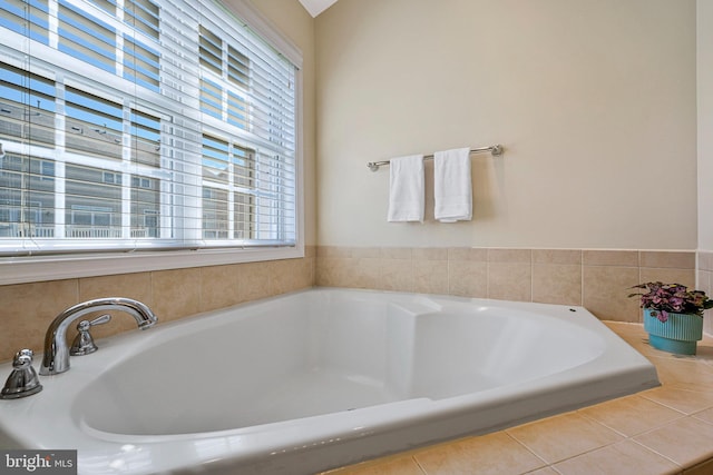 full bathroom featuring tile patterned flooring and a garden tub