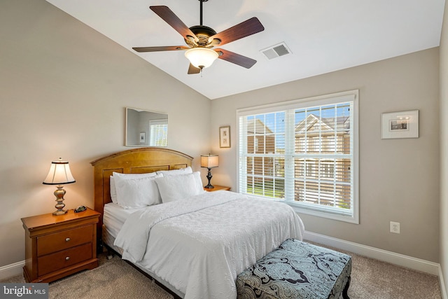 bedroom with visible vents, lofted ceiling, baseboards, ceiling fan, and carpet