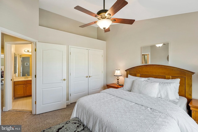 carpeted bedroom featuring a ceiling fan and a closet