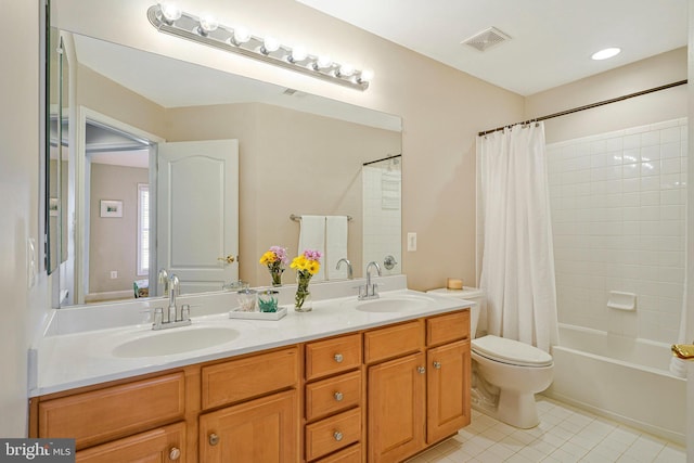 full bath featuring a sink, tile patterned flooring, toilet, and visible vents