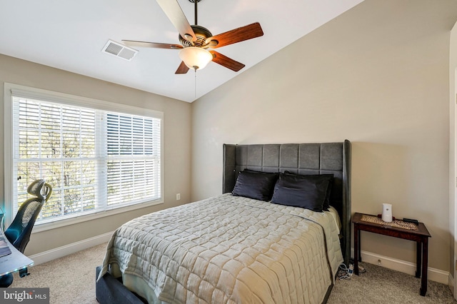 bedroom with baseboards, light colored carpet, and visible vents