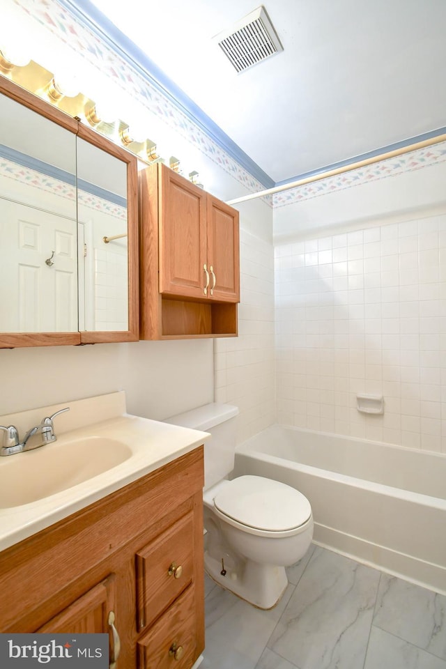 full bathroom with visible vents, vanity, marble finish floor, toilet, and  shower combination
