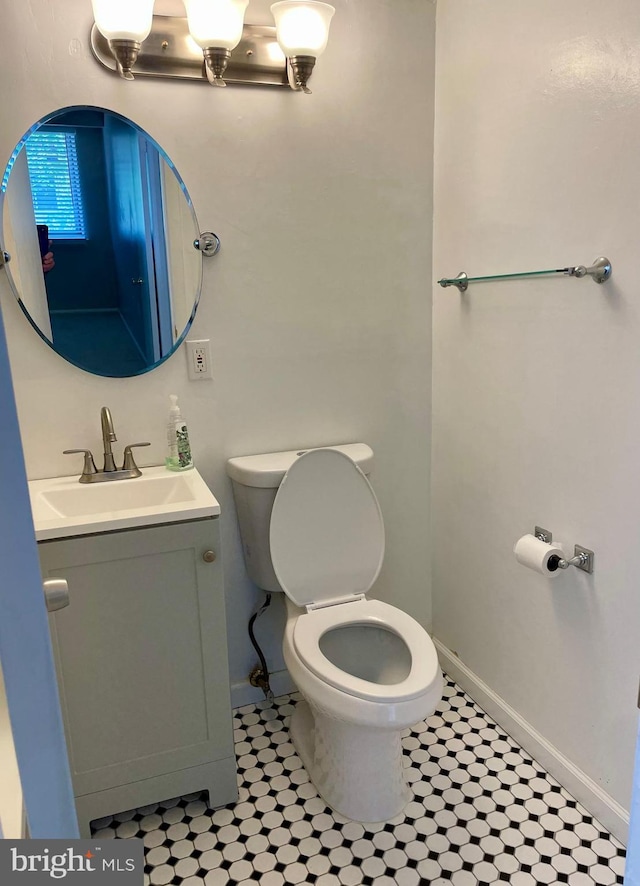 11352 Cherry Hill Rd Unit 1Y304, Beltsville, MD 20705 - half bathroom featuring vanity, baseboards, tile patterned floors, and toilet