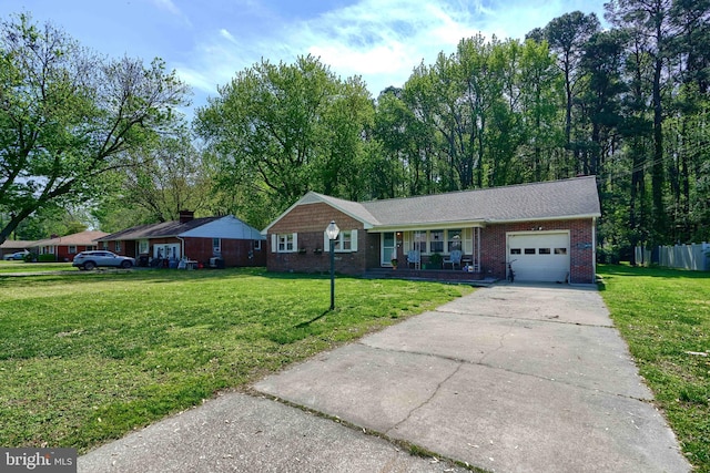 single story home featuring a porch, driveway, a front yard, a garage, and brick siding