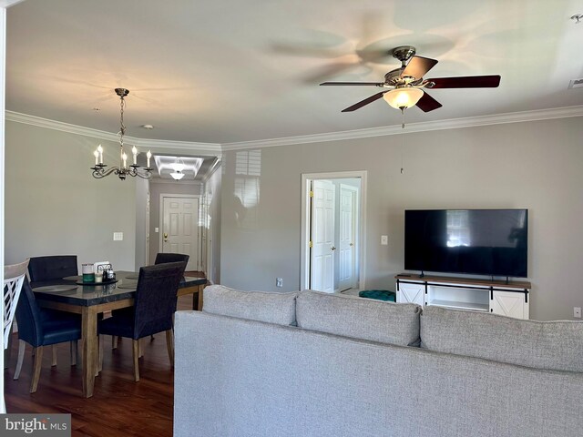 living room with ornamental molding, ceiling fan with notable chandelier, and wood finished floors