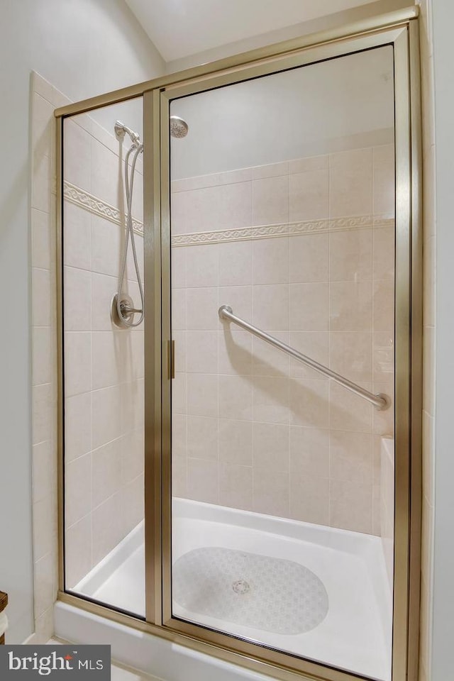 full bath featuring a shower stall