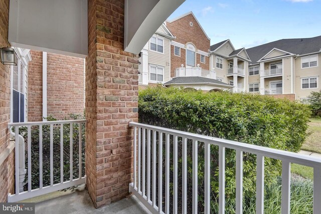 balcony with covered porch and a residential view