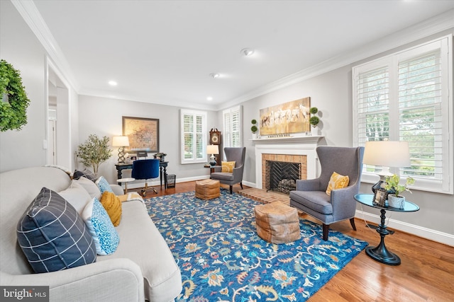 723 Ann Dr, Kennett Square, PA 19348 - living area with plenty of natural light, ornamental molding, a fireplace with flush hearth, wood finished floors, and recessed lighting
