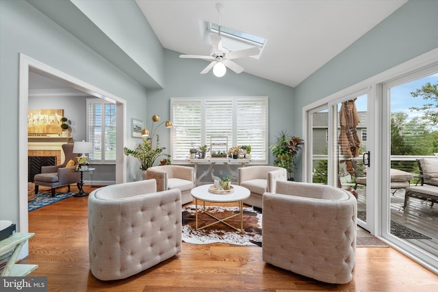 723 Ann Dr, Kennett Square, PA 19348 - living area with plenty of natural light, a fireplace, ceiling fan, and high vaulted ceiling