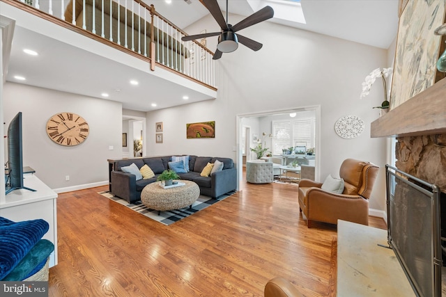 723 Ann Dr, Kennett Square, PA 19348 - living room featuring a ceiling fan, high vaulted ceiling, wood finished floors, baseboards, and recessed lighting
