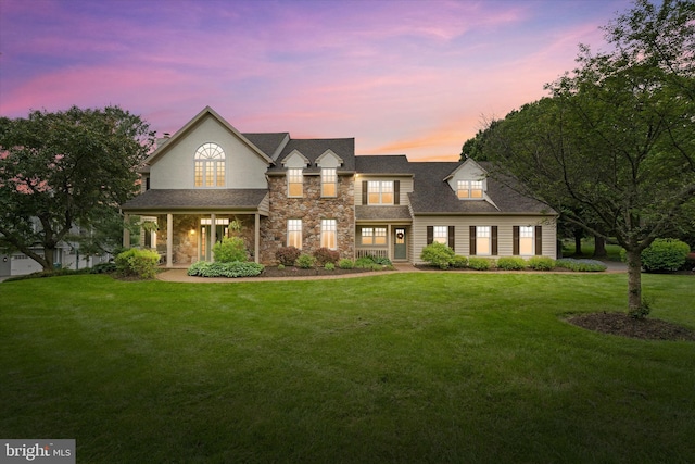 723 Ann Dr, Kennett Square, PA 19348 - view of front facade featuring stone siding and a front yard
