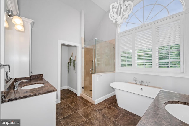 723 Ann Dr, Kennett Square, PA 19348 - full bath with vanity, a stall shower, a freestanding bath, a chandelier, and baseboards