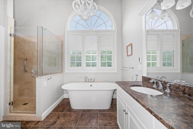 723 Ann Dr, Kennett Square, PA 19348 - full bath with vanity, a shower stall, a freestanding bath, a chandelier, and baseboards