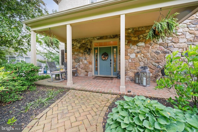 723 Ann Dr, Kennett Square, PA 19348 - doorway to property featuring stone siding and a porch