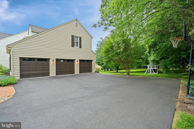 723 Ann Dr, Kennett Square, PA 19348 - garage featuring asphalt driveway