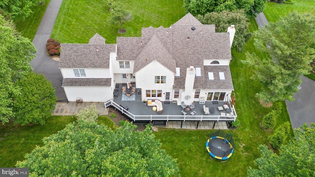 723 Ann Dr, Kennett Square, PA 19348 - rear view of property with a trampoline, an outdoor living space, a deck, a chimney, and a yard