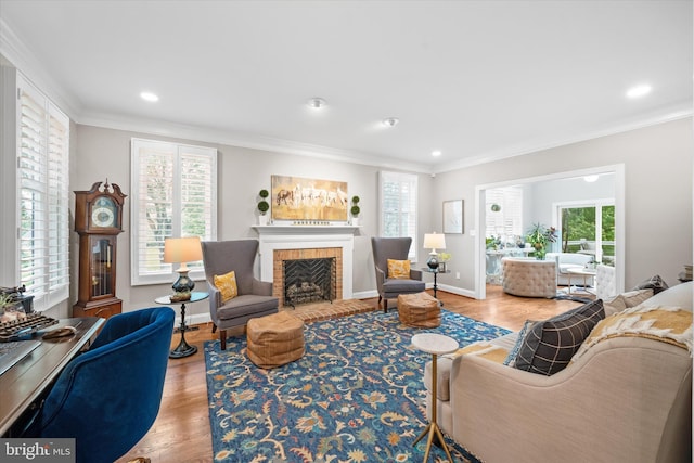 723 Ann Dr, Kennett Square, PA 19348 - living area with ornamental molding, plenty of natural light, wood finished floors, a fireplace with flush hearth, and baseboards