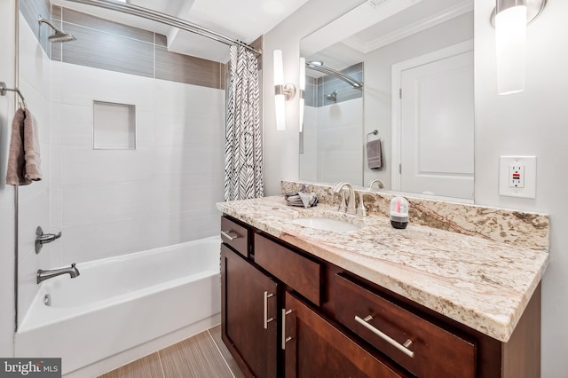 full bathroom featuring vanity, ornamental molding, and shower / tub combo with curtain