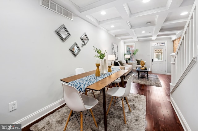 dining room with visible vents, beam ceiling, baseboards, stairway, and dark wood finished floors