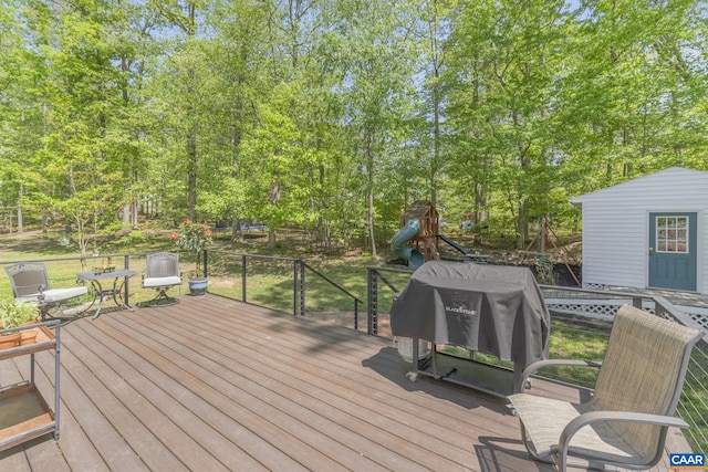 wooden terrace featuring area for grilling