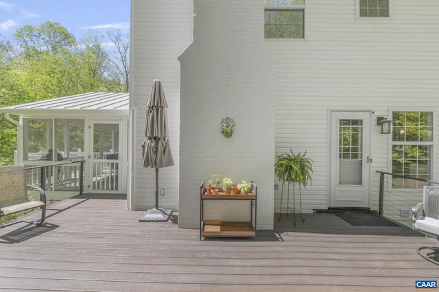 deck with a sunroom