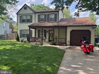 15 Braemar Ave, Blackwood, NJ 08012 - view of front of property with fence, a front yard, an attached garage, driveway, and a porch