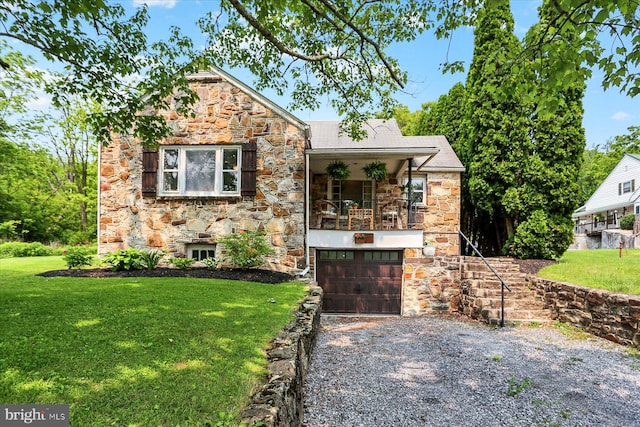 21194 Main St, Shade Gap, PA 17255 - view of front of home with stone siding, an attached garage, gravel driveway, and a front lawn