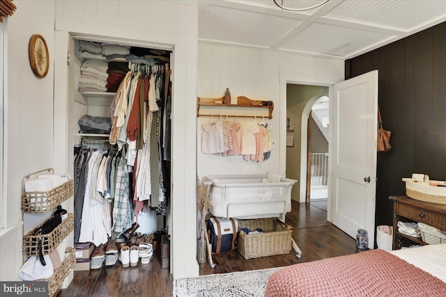 21194 Main St, Shade Gap, PA 17255 - bedroom featuring arched walkways, a closet, wood finished floors, wood walls, and beam ceiling